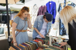 side-view-friends-checking-old-books